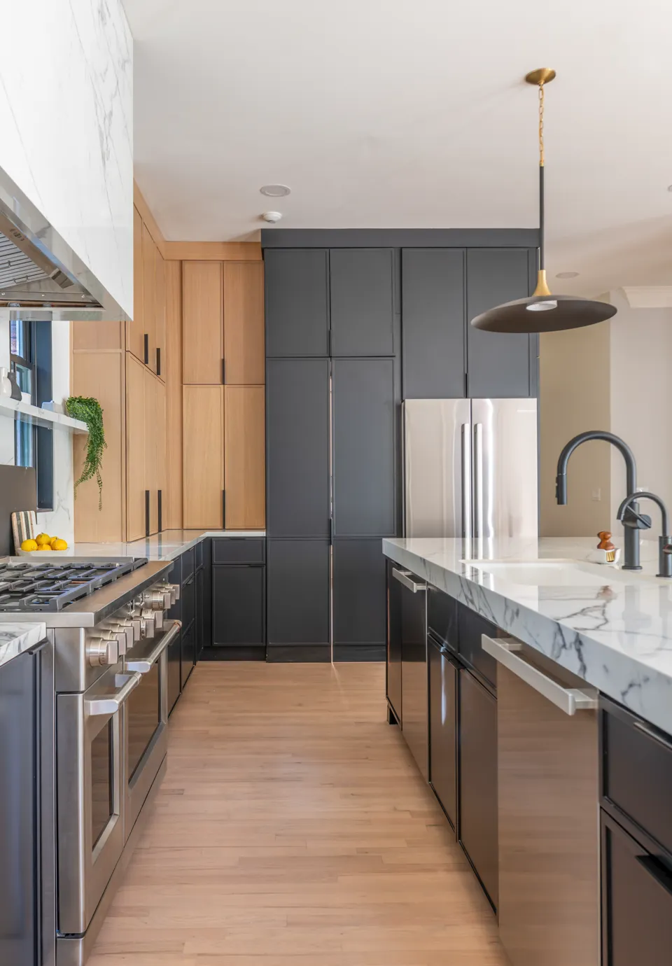 Hidden pantry door closed within custom cabinetry